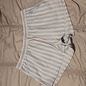 Large Aerie light blue and white striped  shorts with a drawstring waist.